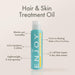 ENJOY Hair & Skin Treatment Oil bottle with features listed on a beige background