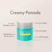 Container of Enjoy Creamy Pomade with features listed on a light gray background