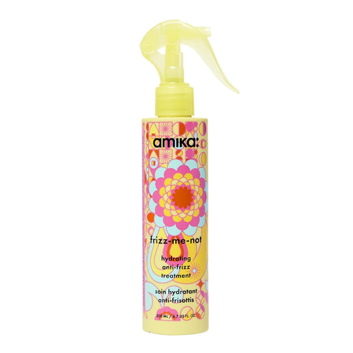 Amika Fizz-Me-Not hair product bottle with colorful yellow label on a white background