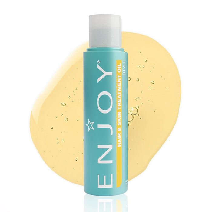 ENJOY hair and skin treatment oil bottle with a yellow background