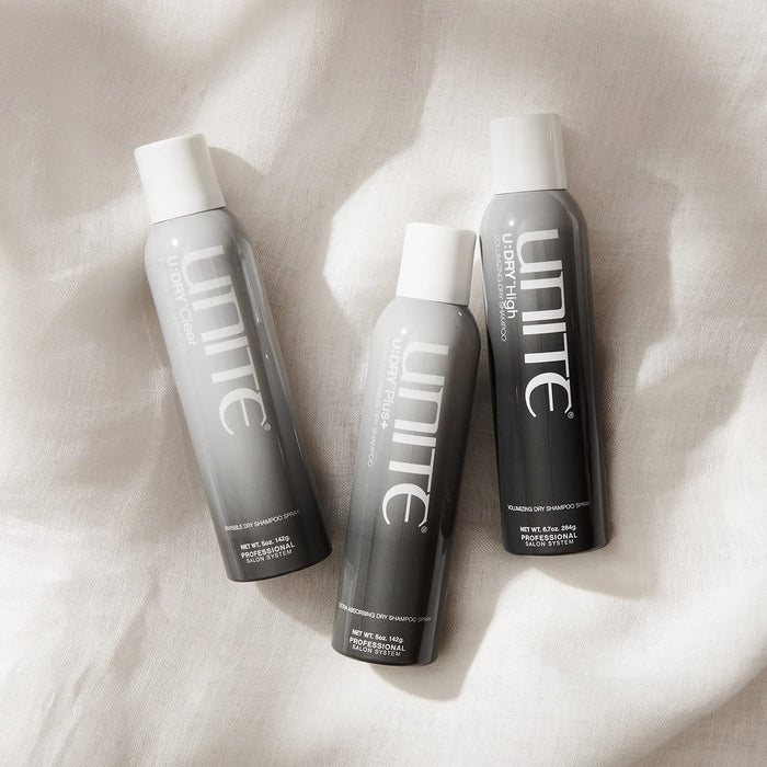 3 Unite Dry shampoos on a white linen background