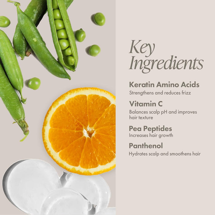 Key ingredients of a hair care product with peas, an orange, and a white cream.