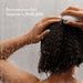 Person washing hair with a shower head, with text 'Because your hair deserves a fresh start.'