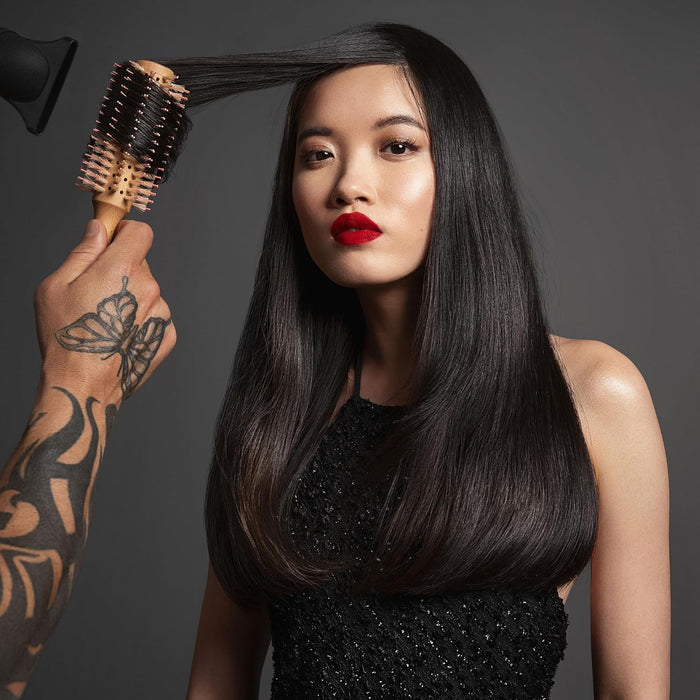 Model using Fromm Mission Sleek Vented Round Boar Brush 